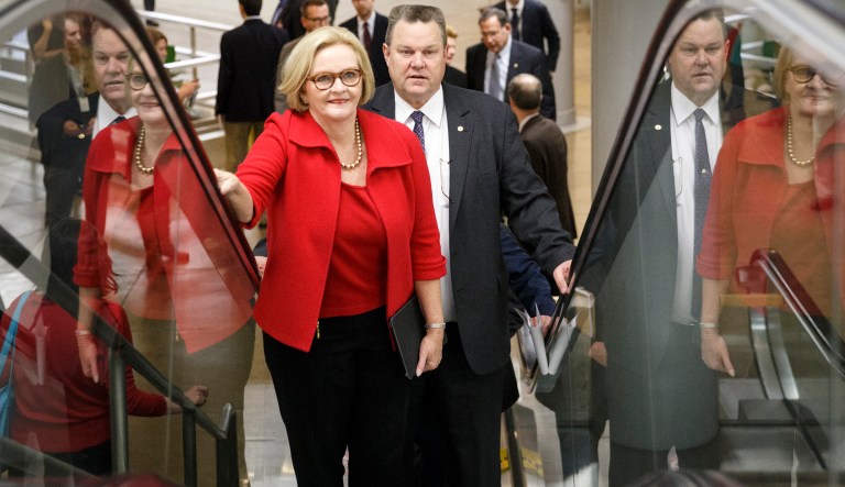 Sen. Claire McCaskill, D-Mo., left, and Sen. Jon Tester, D-Mont., rush to the Senate floor on Capitol Hill in Washington, Thursday, Dec. 11, 2014, for a procedural vote to advance the $585 billion defense bill. With a  midnight Thursday deadline to keep the government running,  a $1.1 trillion government-wide spending bill is teetering as many lawmakers find more in the measure to dislike than like.