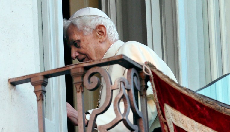 Pope Benedict XVI leaves after a speech.