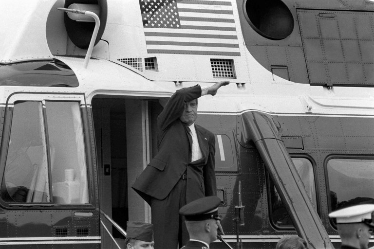 On the day of his resignation, Aug. 9, 1974, Richard M. Nixon waves goodbye from the steps of his helicopter as he leaves the White House following a farewell address to his staff.  The Watergate scandal forced Nixon to become the first U.S. president to resign from office. Critics of President Trump like to compare his troubles with Watergate.