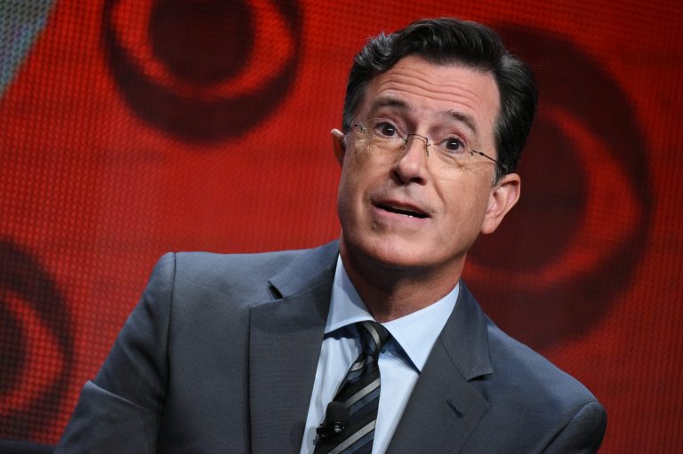 FILE - In this Aug. 10, 2015, file photo, Stephen Colbert participates in "The Late Show with Stephen Colbert" segment of the CBS Summer TCA Tour in Beverly Hills, Calif. Colbert may not respect much of what Donald Trump says, but he does admire the Republican's ability to craft a message that many voters are responding to. "There is a populism to Trump that I find very appealing," Colbert said on an interview to be shown on CBS' "Face the Nation" on Sunday, Dec. 27. "And itÂs only this: the party elders want him to go away, but the people have decided that heÂs not going to."