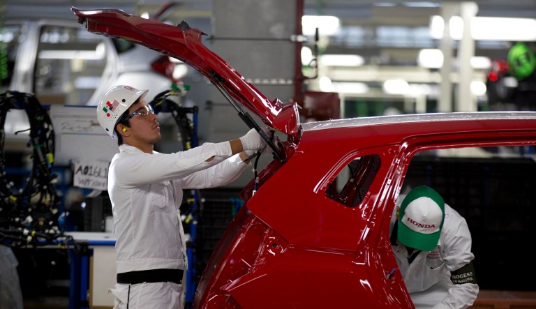 Employees at work in the new multibillion-dollar Honda car plant in Celaya, in the central Mexican state of Guanajuato, Friday, Feb. 21, 2014.