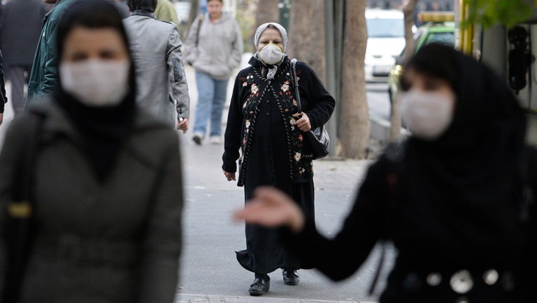 Iranian women wear masks to help guard against dangerous levels of air pollution as they walk in the center of the smog-filled capital, Tehran, Iran.