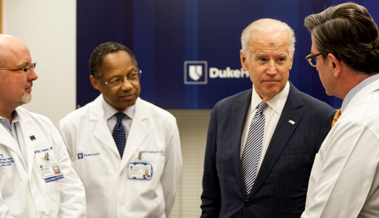 Vice President Joe Biden speaks with Dr. Matthias Gromeier, left, Dr. A. Eugne Washington, middle, and Dr. John Sampson, right, in a laboratory at Duke University School of Medicine in Durham, N.C. Wednesday, Feb. 10, 2016. Vice President Joe Biden visited Duke University Medical Center to speak about his Cancer Moonshot initiave.