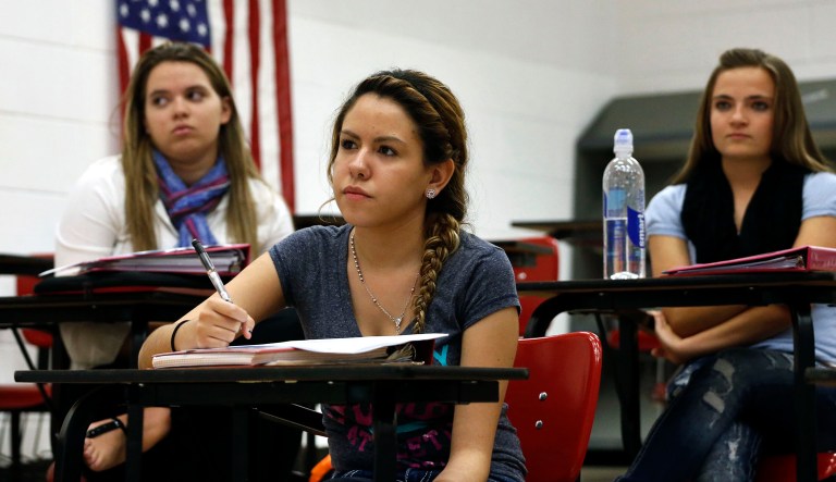 Navil Babonayaba, 16, center, a student at Yuma High School participates in her civics class in the rural farm town of Yuma in eastern Colorado.