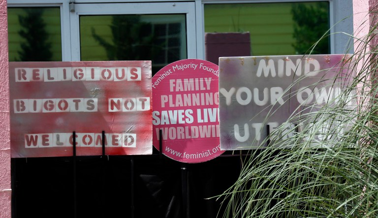 Razor grass and pro-choice signs limit the view of patients entering the Jackson Women's Health Organization clinic in Jackson, Miss., Tuesday, June 30, 2015.