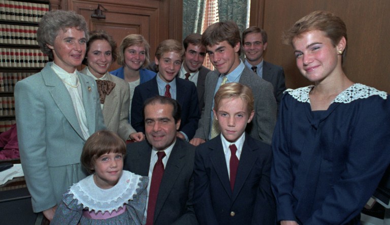 Supreme Court Associate Justice Antonin Scalia poses with his family in his chambers before court ceremonies in 1986 in Washington, D.C. Pictured are, front row, from left: Margaret Jane; Justice Scalia, Christopher, and Mary. In the back are, from left: Mrs. Scalia, Ann Forrest, Elizabeth, Matthew, Eugene, John, and Paul. 