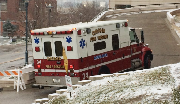 An ambulance carrying drives to the Nebraska Medical Center in Omaha, Neb.