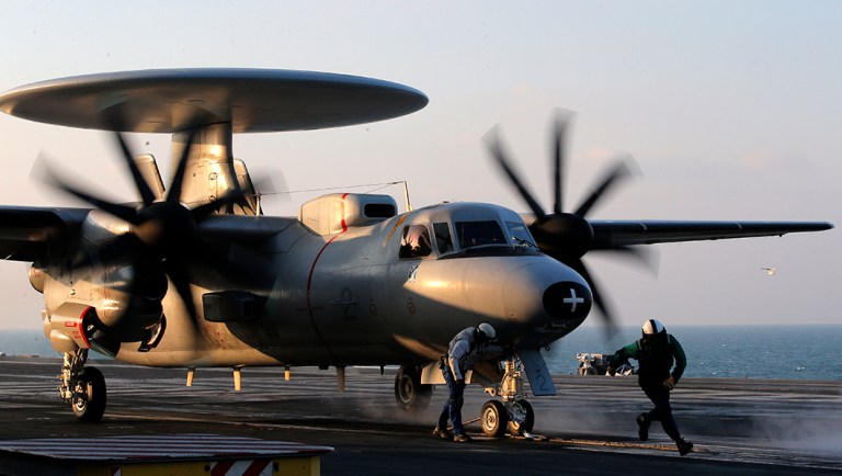 An E-2C Hawkeye is catapulted for a mission on France's flagship Charles de Gaulle aircraft carrier in the Persian Gulf.