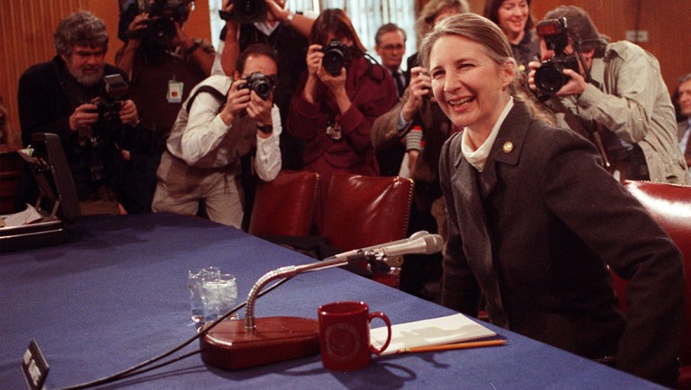 April Glaspie, former U.S. ambassador to Iraq, poses for photographers.