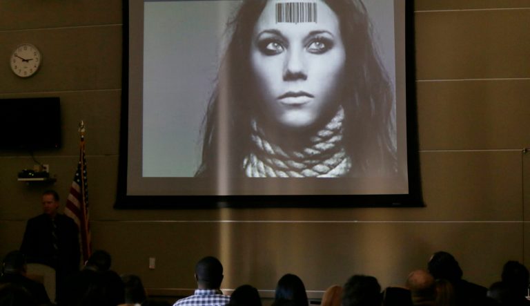 In this Tuesday, Jan. 12, 2016 photo, members of  Club Owners Against Sex Trafficking attend a presentation by Department of Homeland Security agent teaching owners of strip clubs and strippers how to spot sex traffickers, at the Burbank Community Services Building in Burbank, Calif. ICE officials had learned that operators of such clubs were often clueless about spotting sex traffickers. 