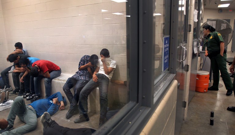 Immigrants who have been caught crossing the border illegally are housed inside the McAllen Border Patrol Station in McAllen, Texas, where they are processed on Tuesday, July 15, 2014.