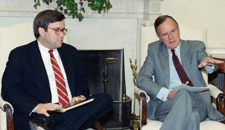 President George H.W. Bush gestures while talking to Attorney General William Barr in the Oval Office of the White House, Monday, May 4, 1992 in Washington. 