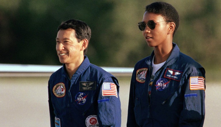 Payload specialist Mamoru Mohri of Hokkaido, Japan, and Mission Specialist Mae Jemison of Chicago, Ill., walk together after arriving with the rest of the STS-47 crew, Sept. 9, 1992, at Kennedy Space Center, Fla.