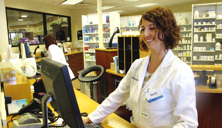 Pharmacist Sarah Burke checks a prescription at a Kroger pharmacy in Columbus, Ohio.