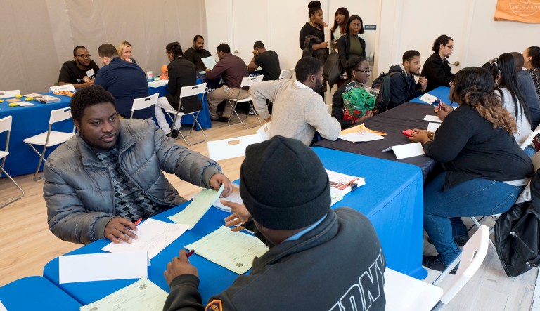 Students talks with recruiters from the Fire Department City of New York during a job fair. The fair is part of the Urban Youth Jobs Program for 16 to 24-year-olds. 