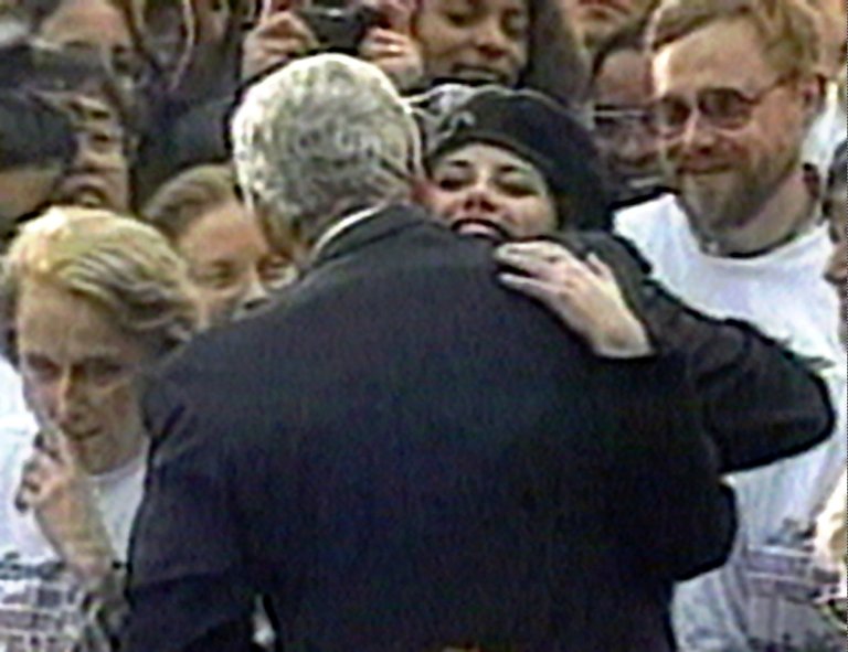 In this image taken from video, Monica Lewinsky embraces President Clinton as he greeted well-wishers at a White House lawn party in Washington Nov. 6, 1996.