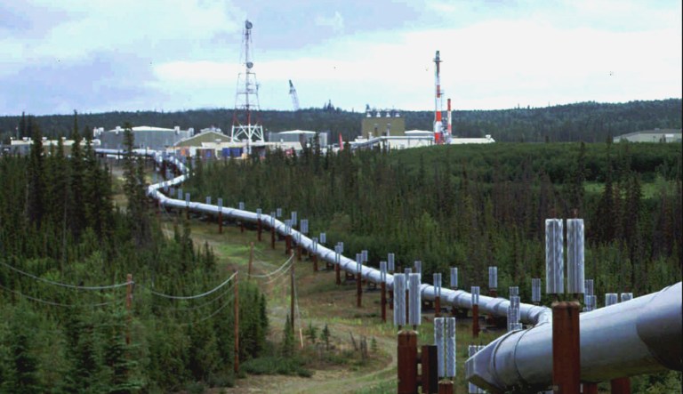 The Trans-Alaska pipeline and pump station north of Fairbanks, Alaska is shown.