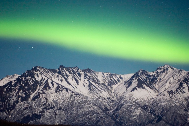 A band of Aurora stretches over the Chugach Range near Palmer, Alaska, Tuesday, Feb. 27, 2007.