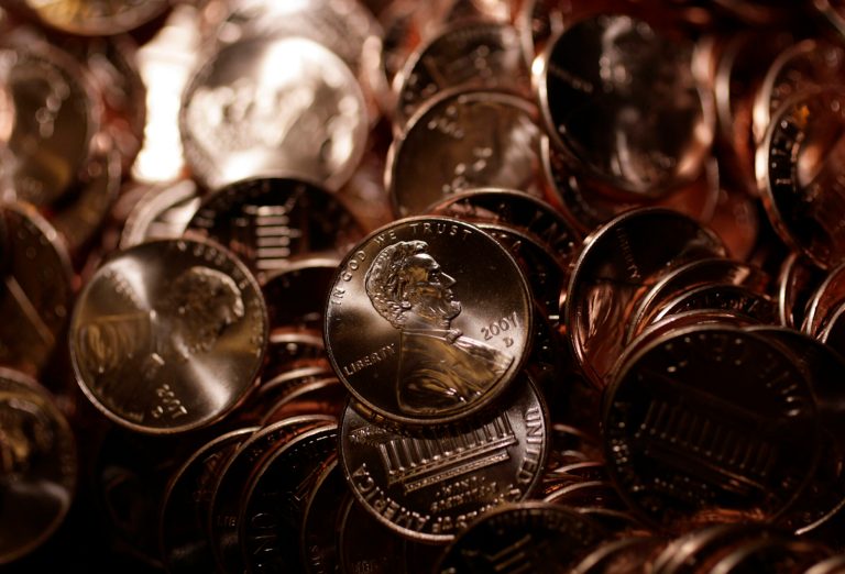 Pennies shine in a bin at the U.S. Mint in Denver. Because of a surge in the price of zinc and copper, it now costs the U.S. Mint over 2 cents to produce a penny.