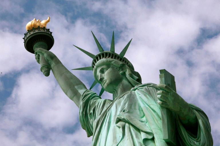 In this June 2, 2009 photo, the Statue of Liberty is seen in New York harbor. The crown is set to open July 4 after being closed since shortly after the Sept. 11, 2001, terrorist attacks. 