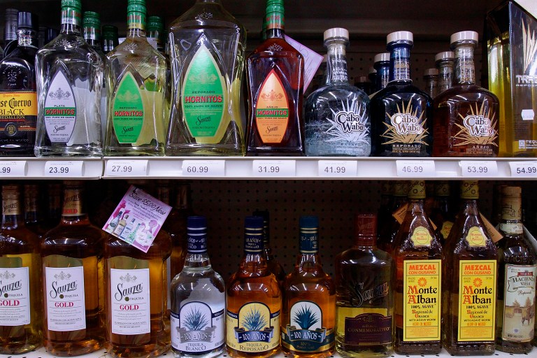 Bottles of alcohol are seen lining the selves of a liquor store in Springfield, Ill., Monday, Aug 31, 2009.  (AP Photo/Seth Perlman)