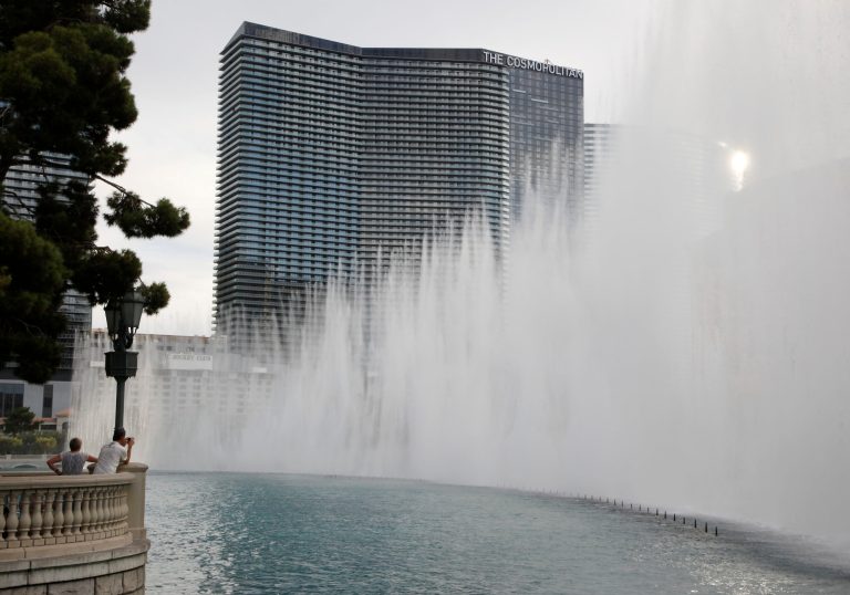 The Cosmopolitan of Las Vegas hotel-casino is framed in the fountains of the Bellagio hotel-casino Wednesday, Aug. 25, 2010.