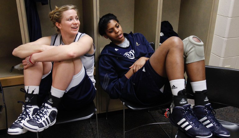 Notre Dame's Mary Forr, left, and Ariel Braker relax in the locker room before practice for the women's NCAA Final Four national championship college basketball game in Indianapolis, Monday, April 4, 2011.