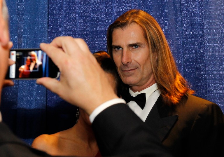 Actor Fabio poses for a photo at the National Italian American Foundation's annual gala in Washington, Saturday, Oct. 29, 2011. 