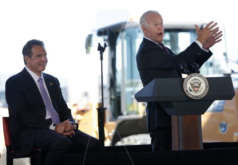 While New York Governor Andrew Cuomo, left, looks on, former Vice President Joe Biden speaks during a news conference at LaGuardia Airport in New York, Tuesday, June 14, 2016. Cuomo is seen as a potential Democratic National Convention pick if there no first ballot winner.