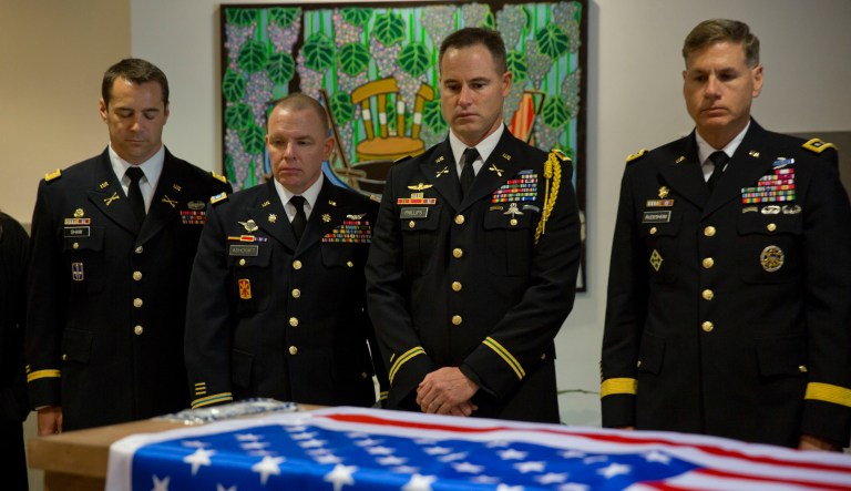 In this March 11, 2016 file photo, US military officers stand around the coffin of American Taylor Force, a 28-year-old MBA student at Vanderbilt University and a West Point graduate, who was killed in a stabbing attack, during a private ceremony, at Ben Gurion airport, near Tel Aviv, Israel. 