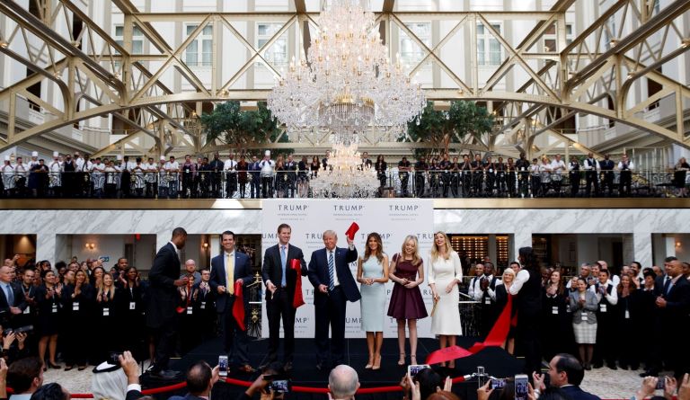 Republican presidential candidate Donald Trump, accompanied by, from left, Donald Trump Jr., Eric Trump, Tiffany Trump, Melania Trump, and Ivanka Trump, speaks during the grand opening of the Trump International Hotel- Old Post Office, Wednesday, Oct. 26, 2016, in Washington. (AP Photo/ Evan Vucci)