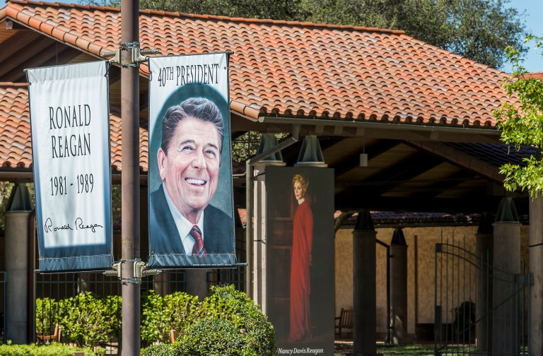 Portraits of former President Ronald Reagan and former first lady Nancy Reagan are displayed next to each other at the main entrance of the Ronald Reagan Presidential Library in Simi Valley, California, on Tuesday, March 8, 2016. 