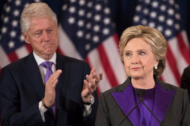 Former President Bill Clinton applauds as his wife, Democratic presidential candidate Hillary Clinton speaks in New York, Wednesday, Nov. 9, 2016, where she conceded her defeat to Republican Donald Trump after the hard-fought presidential election.