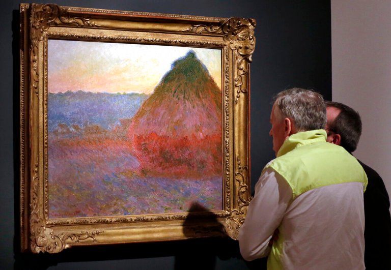 Climate change activists throw mashed potatoes on Monet painting in Germany