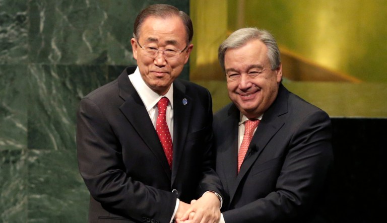 In this Dec. 12, 2016 file photo, current United Nations Secretary-General Ban Ki-moon, left, clasps hands with U.N. Secretary-General designate Antonio Guterres after Guterres was sworn in at U.N. headquarters.