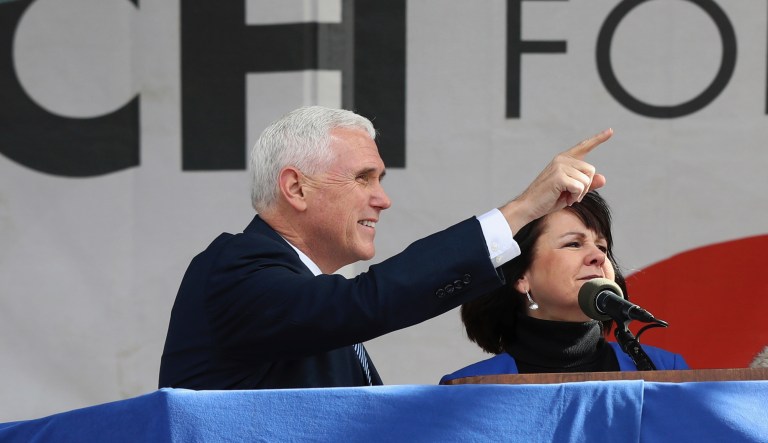 Vice President Mike Pence, left, with his wife Karen Pence, wave to the crowd at the March for Life on the National Mall in Washington, Friday, Jan. 27, 2017.