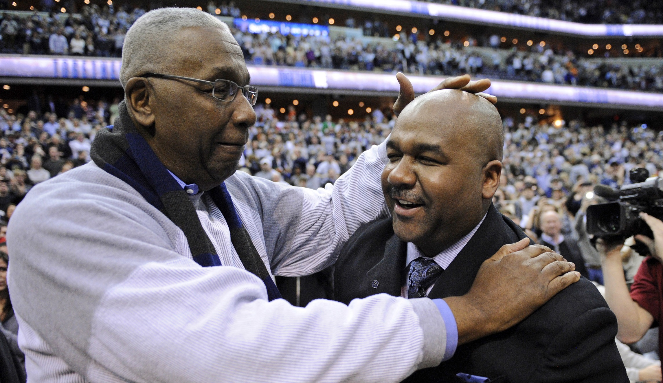From students to our coach, one last huge hug for Big John Thompson