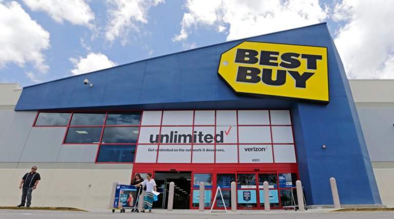 In this Monday, May 22, 2017, photo, people walk out of a Best Buy store after purchasing an LED TV, in Hialeah, Fla. (AP Photo/Alan Diaz)