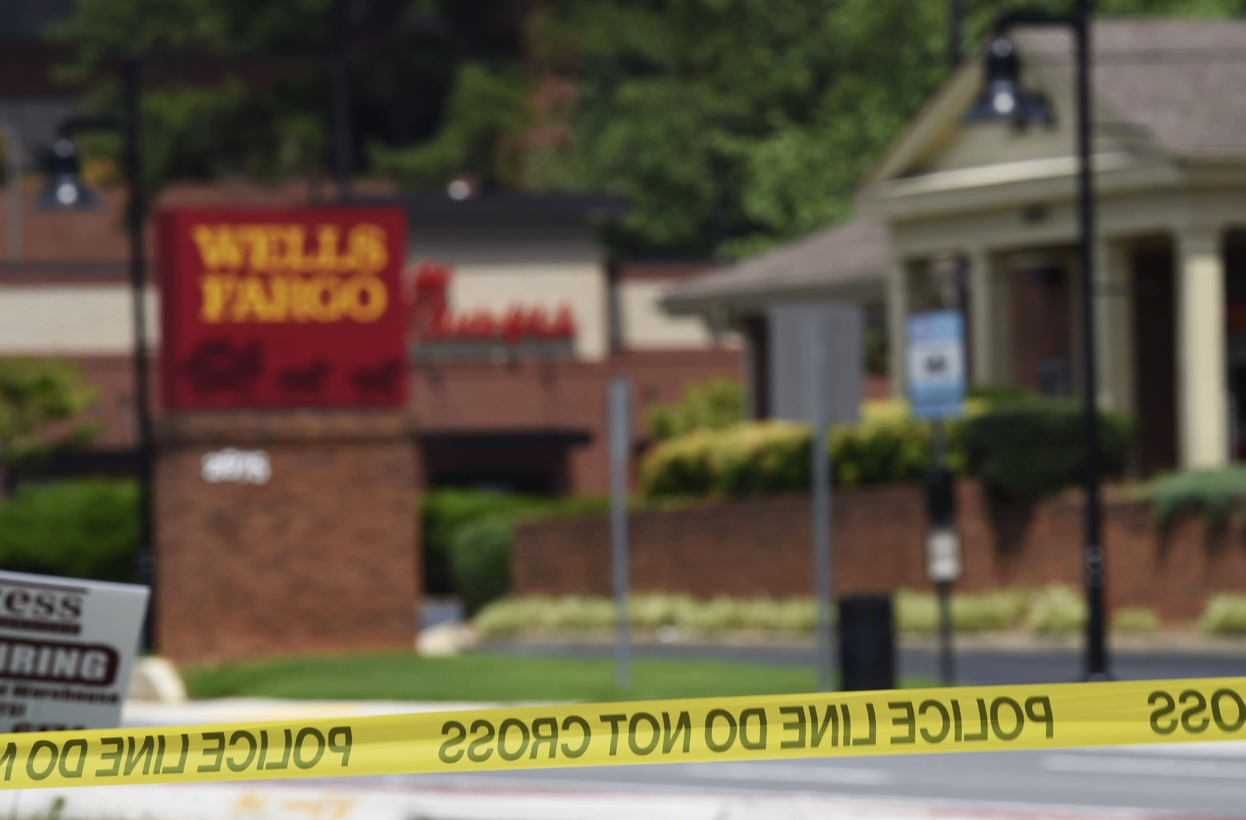 Five hostages uninjured and suspect arrested after Minnesota bank standoff ends