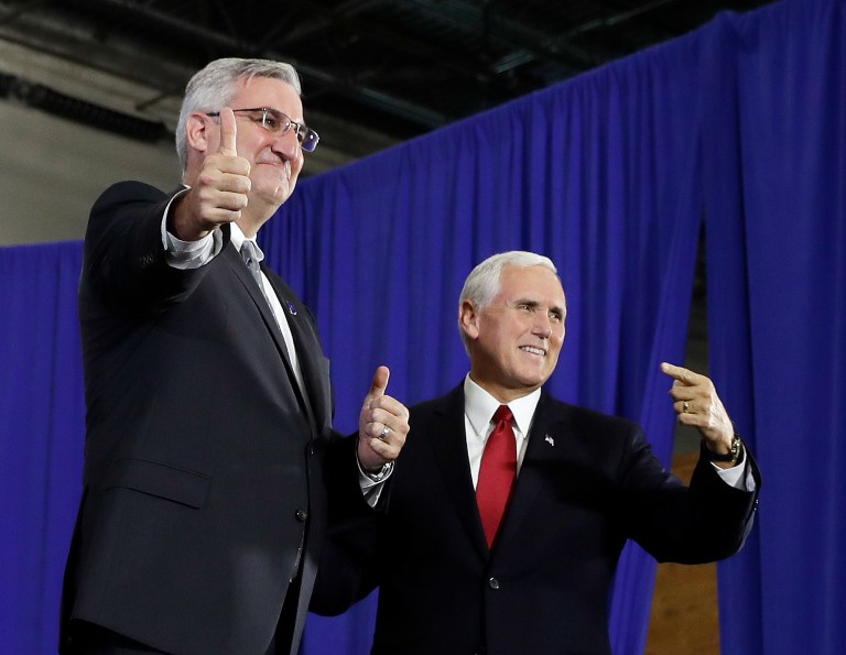 Vice President Mike Pence is introduced by Indiana Gov. Eric Holcomb at the Wylam Center of Flagship East, Friday, Sept. 22, 2017, in Anderson, Ind.