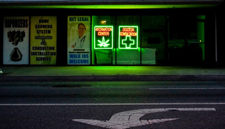 In this June 12, 2010, file photo, a medical marijuana dispensary leaves its lights on after hours on in Los Angeles. California is pulling ads aimed at discouraging stoned driving after critics said it promoted marijuana use. The ad campaign was rolled out as California began allowing licensed stores to sell pot to adults on Jan. 1, 2018.