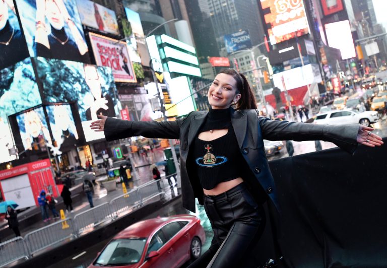 Supermodel Bella Hadid posts photo giving middle finger to NYPD officers and shames them for not wearing masks