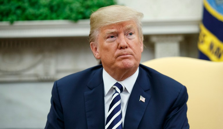 President Trump pauses during a meeting in the Oval Office of the White House, Tuesday, March 20, 2018, in Washington.