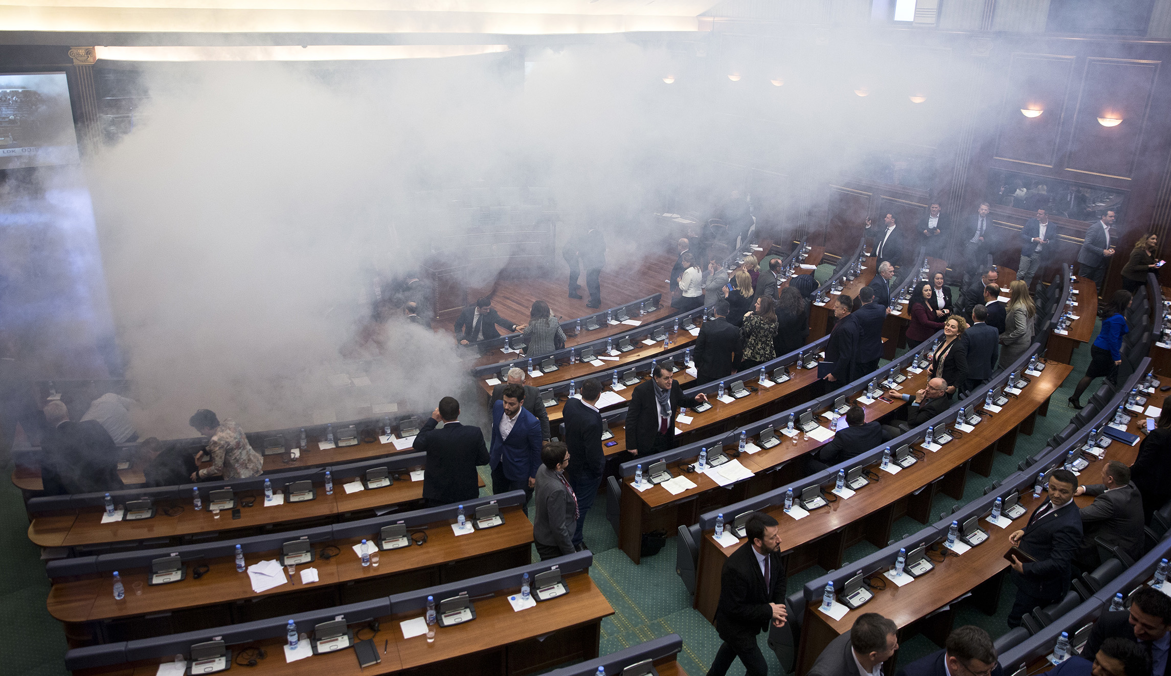 Kosovo opposition party drops smoke bombs in parliament to thwart vote on border deal