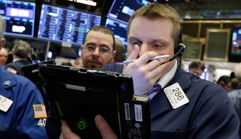 Trader works on the floor of the New York Stock Exchange, Monday. U.S. stocks rose sharply in early trading Monday as the market made up some of its huge losses from last week. 