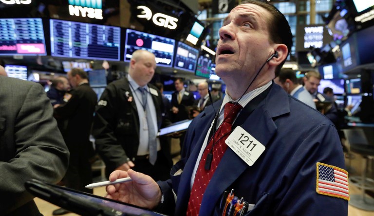 A trader works on the floor of the New York Stock Exchange. 