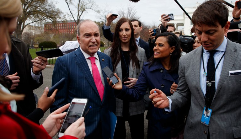 White House chief economic adviser Larry Kudlow talks with reporters outside the White House. 