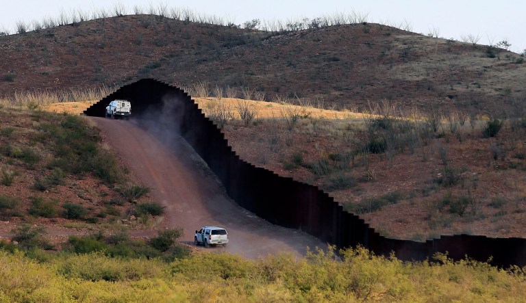U.S. Border Patrol agents patrol the border fence in Naco, Ariz. National guard contingents in U.S. states that border Mexico say they are waiting for guidance from Washington to determine what they will do following President Trump's proclamation directing deployment to fight illegal immigration and drug smuggling. 