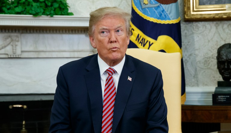 President Donald Trump listens during a meeting with the Emir of Qatar Sheikh Tamim bin Hamad al-Thani in the Oval Office of the White House, Tuesday, April 10, 2018, in Washington. 