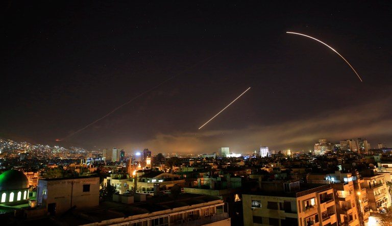 Missiles streak across the Damascus skyline as the U.S. launches an attack on Syria targeting different parts of the capital, early Saturday.